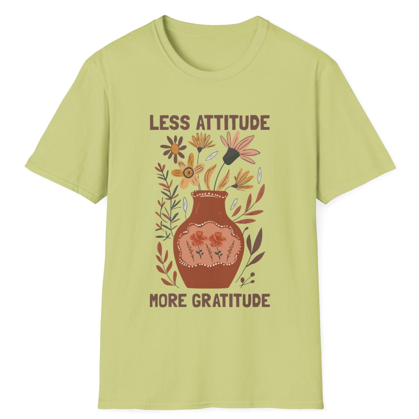 Light green t-shirt with floral design and text 'LESS ATTITUDE MORE GRATITUDE' on a white background